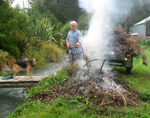 One of the many loads of fallen tree rubbish going on the fire. One of the many loads of fallen tree rubbish going on the fire.