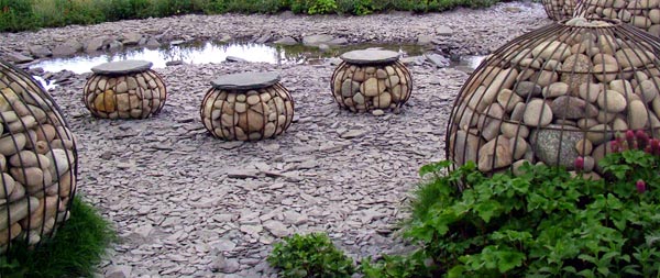 large round spheres dot this shale grey water landscape